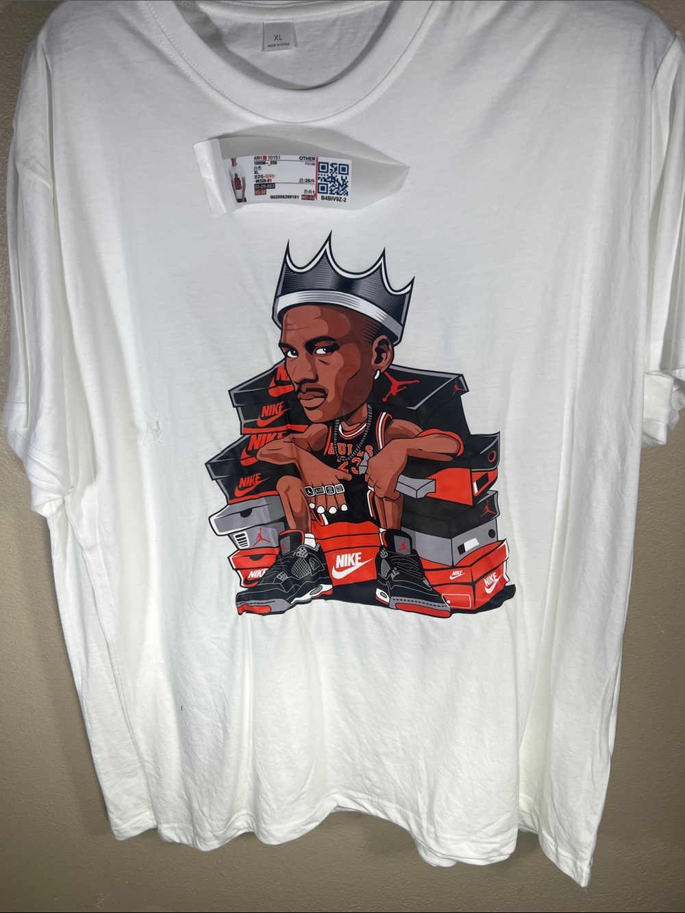 White Graphic Tee with Crowned Character and Sneaker Stack